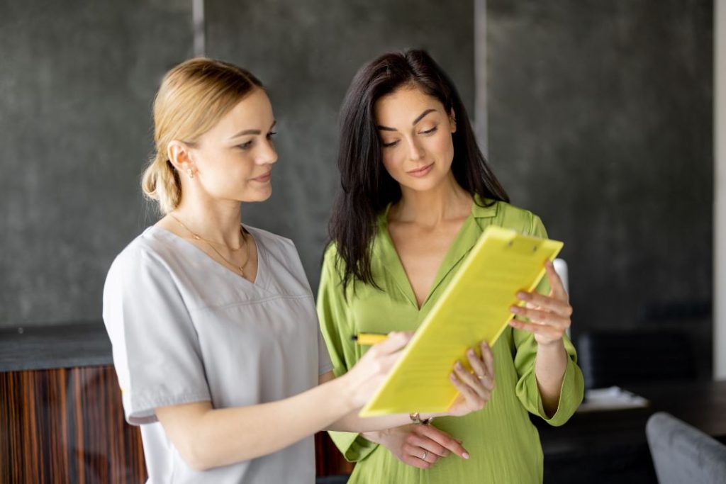 Old Town Fitness nutrition coach discussing meal plan with a member